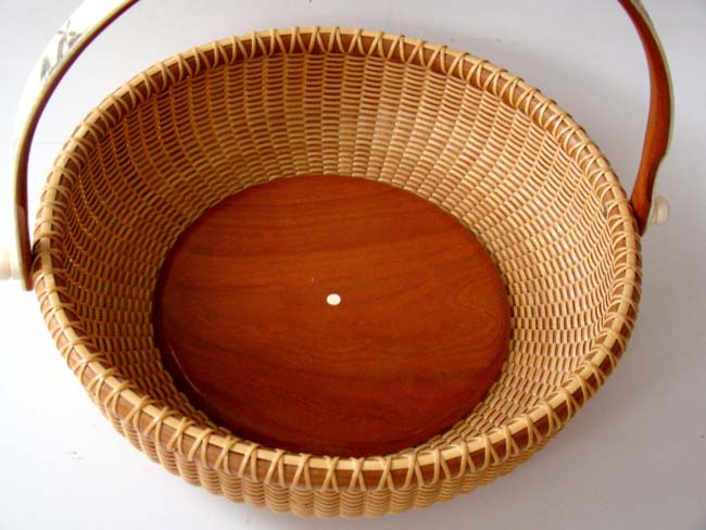An exquisite NANTUCKET style basket with the ivory handle engraved with scenes of CHATHAM